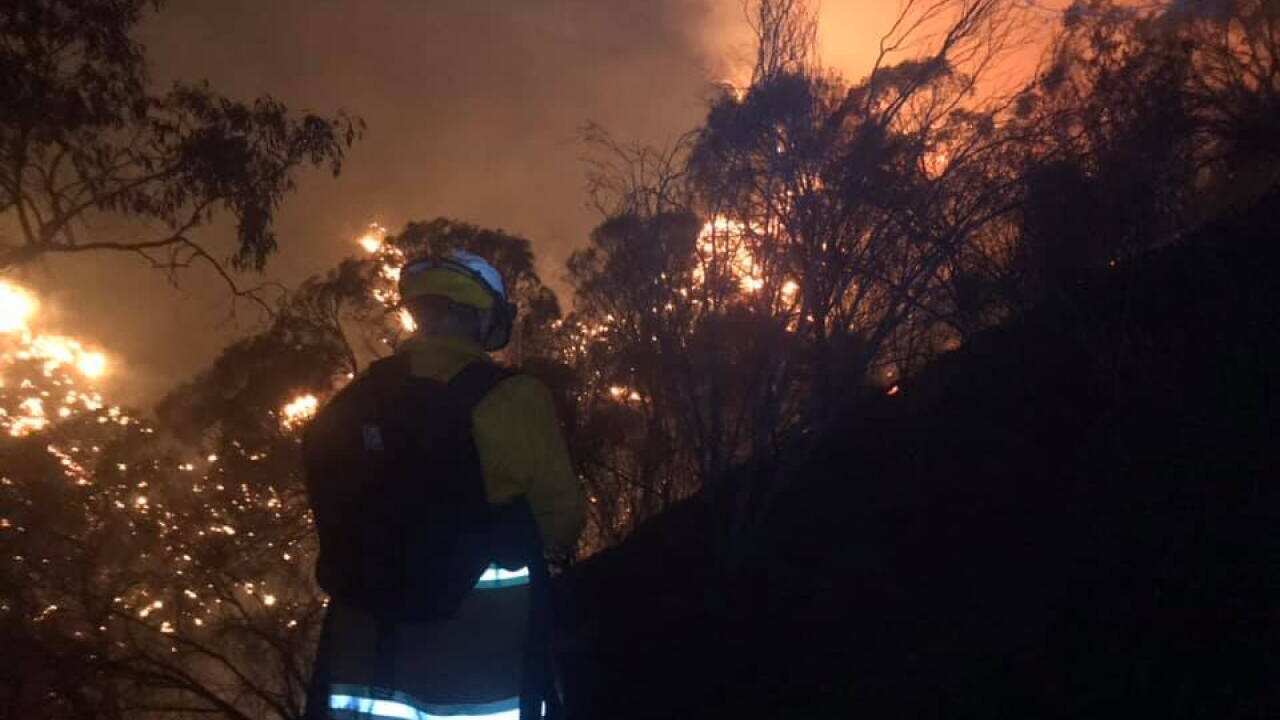 A bushfire continues to burn uncontrolled in the Adelaide Hills