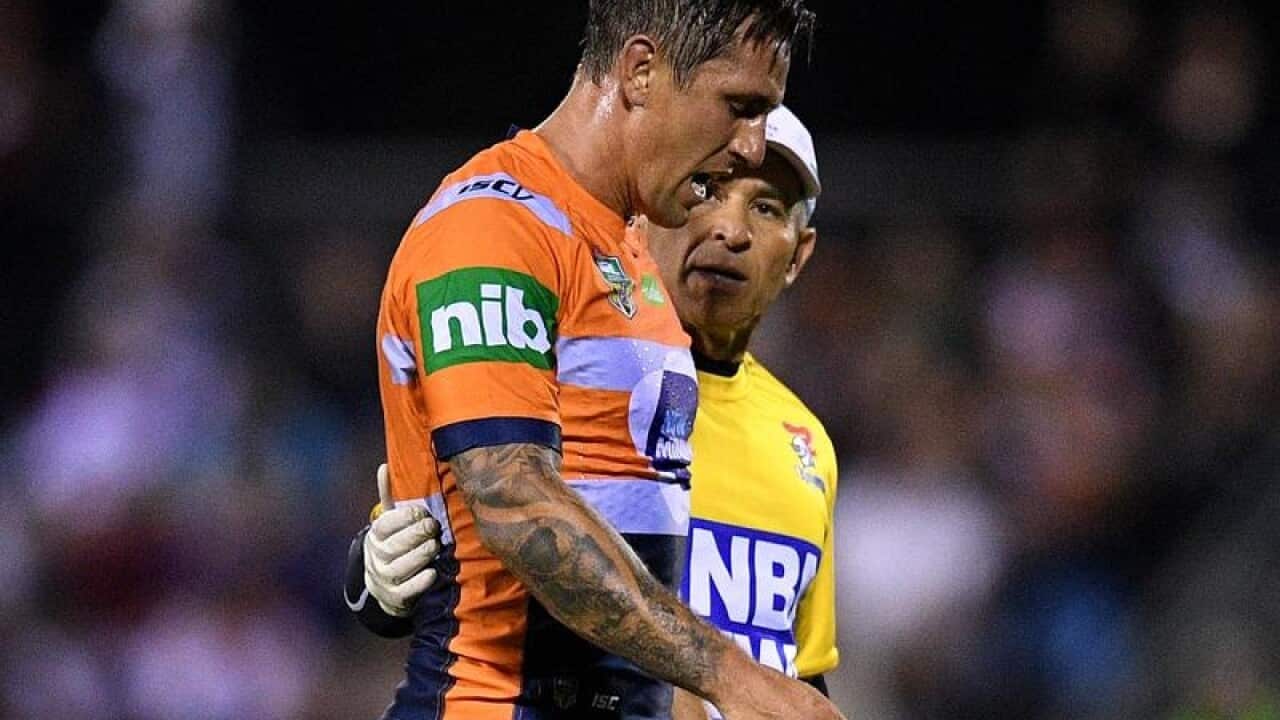 Mitchell Pearce leaves the field in Tamworth.