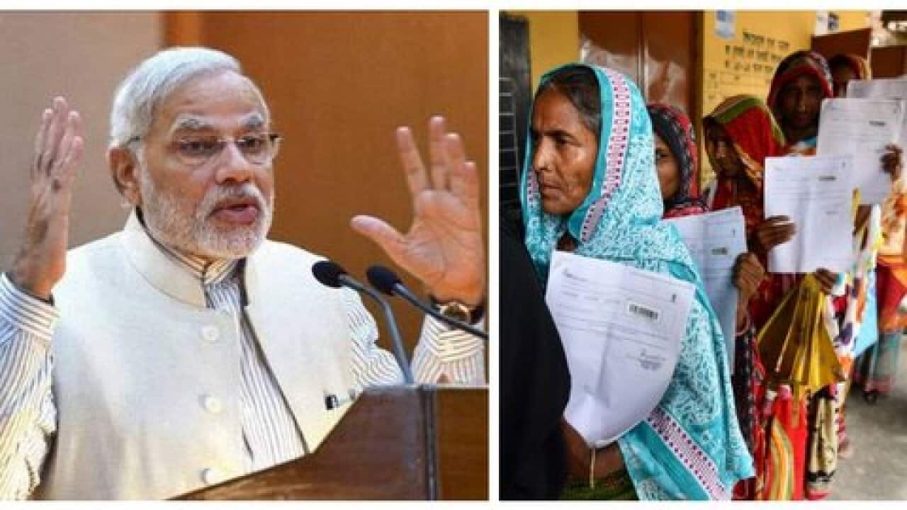 Narendra Modi_Residents queue to check their names on the final National Register of Citizens