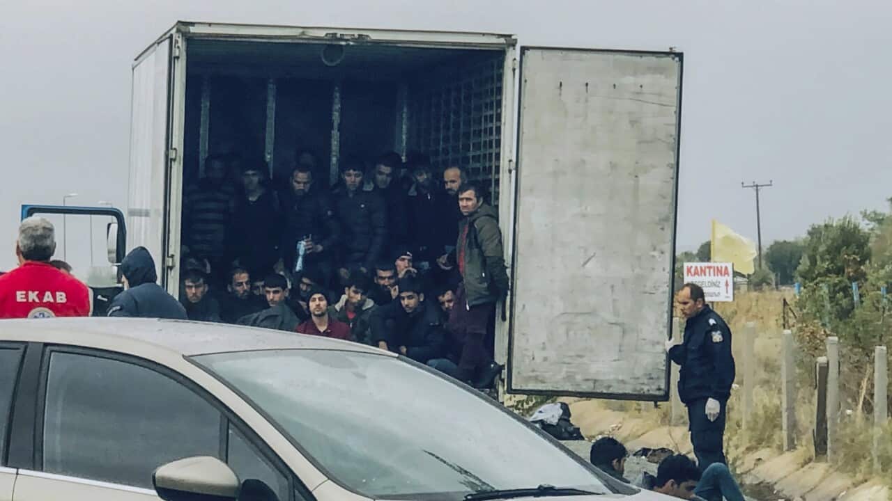 Migrants are seen inside a truck found by police, near the town of Xanthi, on Monday, Nov. 4, 2019.