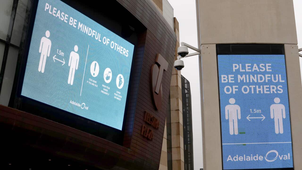 Social distancing signs are seen prior to the Round 2 AFL match between the Port Adelaide Power and the Adelaide Crows at Adelaide Oval in Adelaide, Saturday, June 13, 2020. (AAP Image/Kelly Barnes) NO ARCHIVING