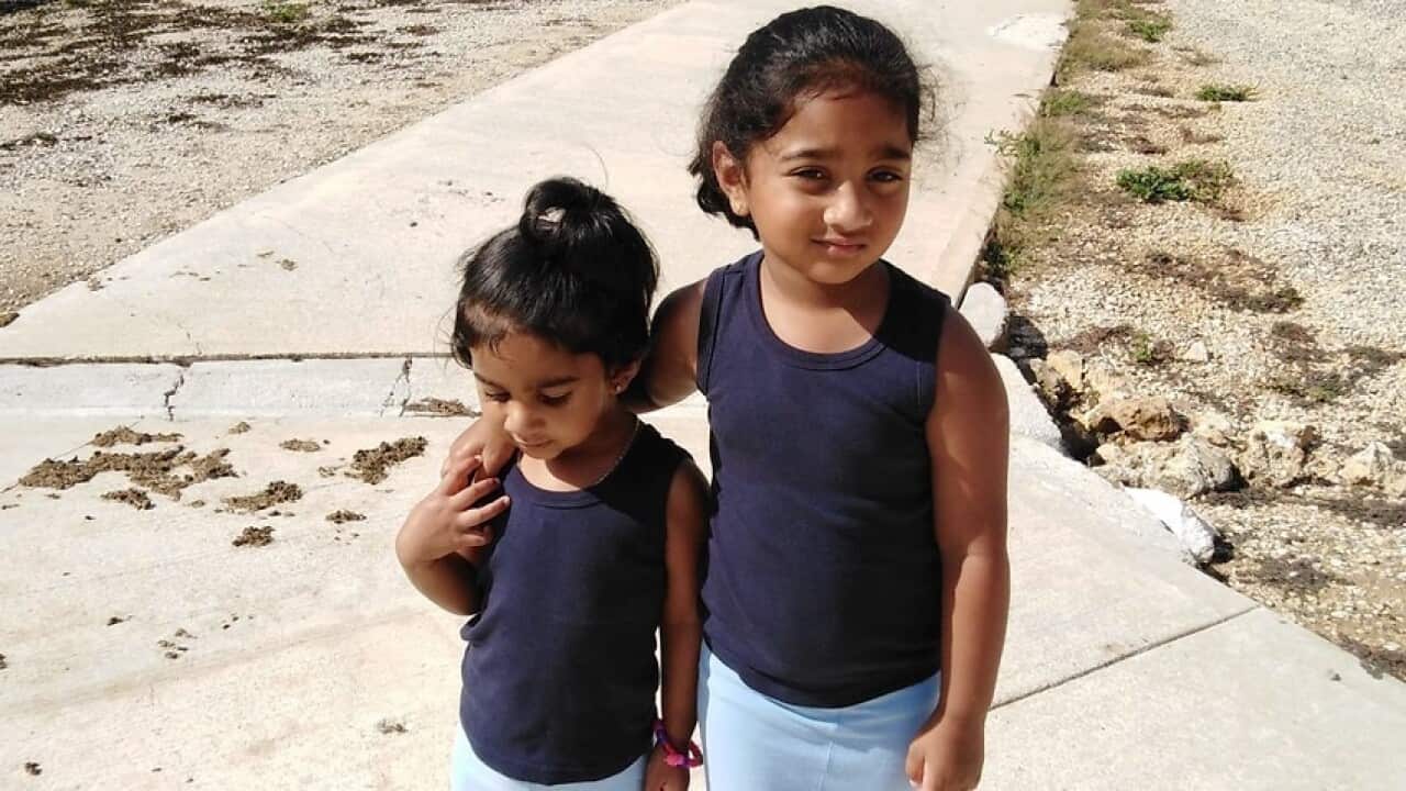 Kopika (right) and Tharunicaa, the daughters of the Biloela Tamil family at the detention centre on Christmas Island
