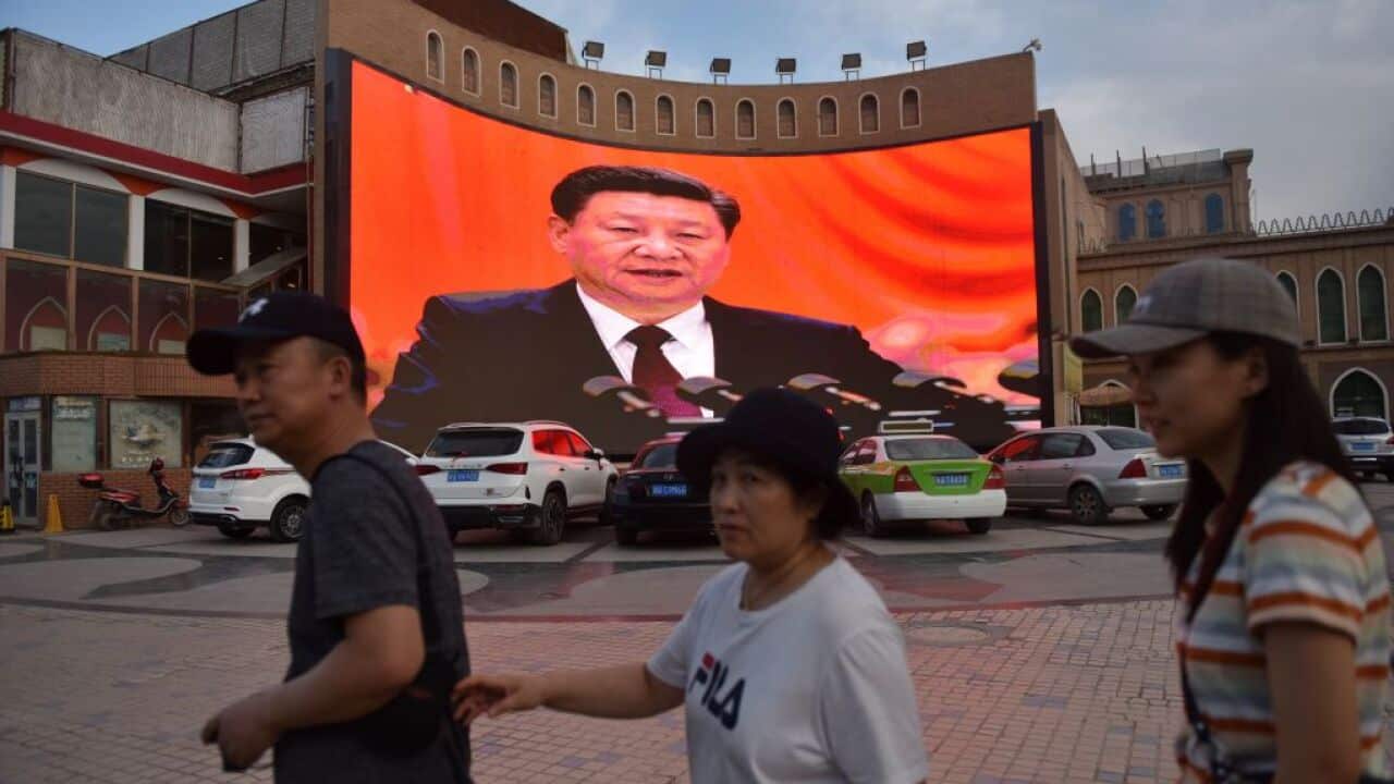 A screen in Kashgar shows images of Chinese President Xi Jinping.