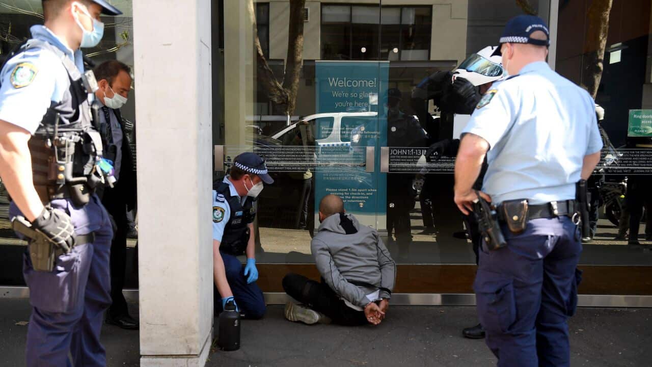 A man is arrested by NSW Police during an anti-lockdown protest in Sydney