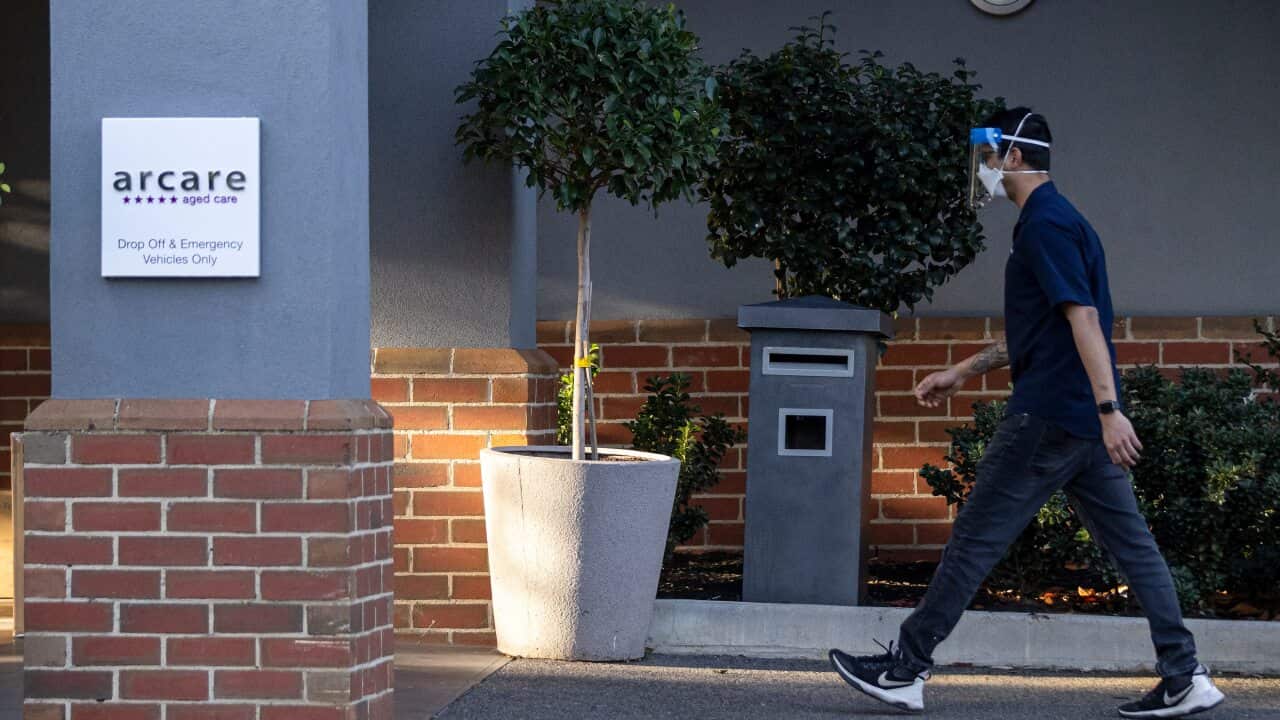 A staff member is seen entering the Arcare Aged Care facility in Maidstone, Melbourne, Monday, 31 May, 2021.