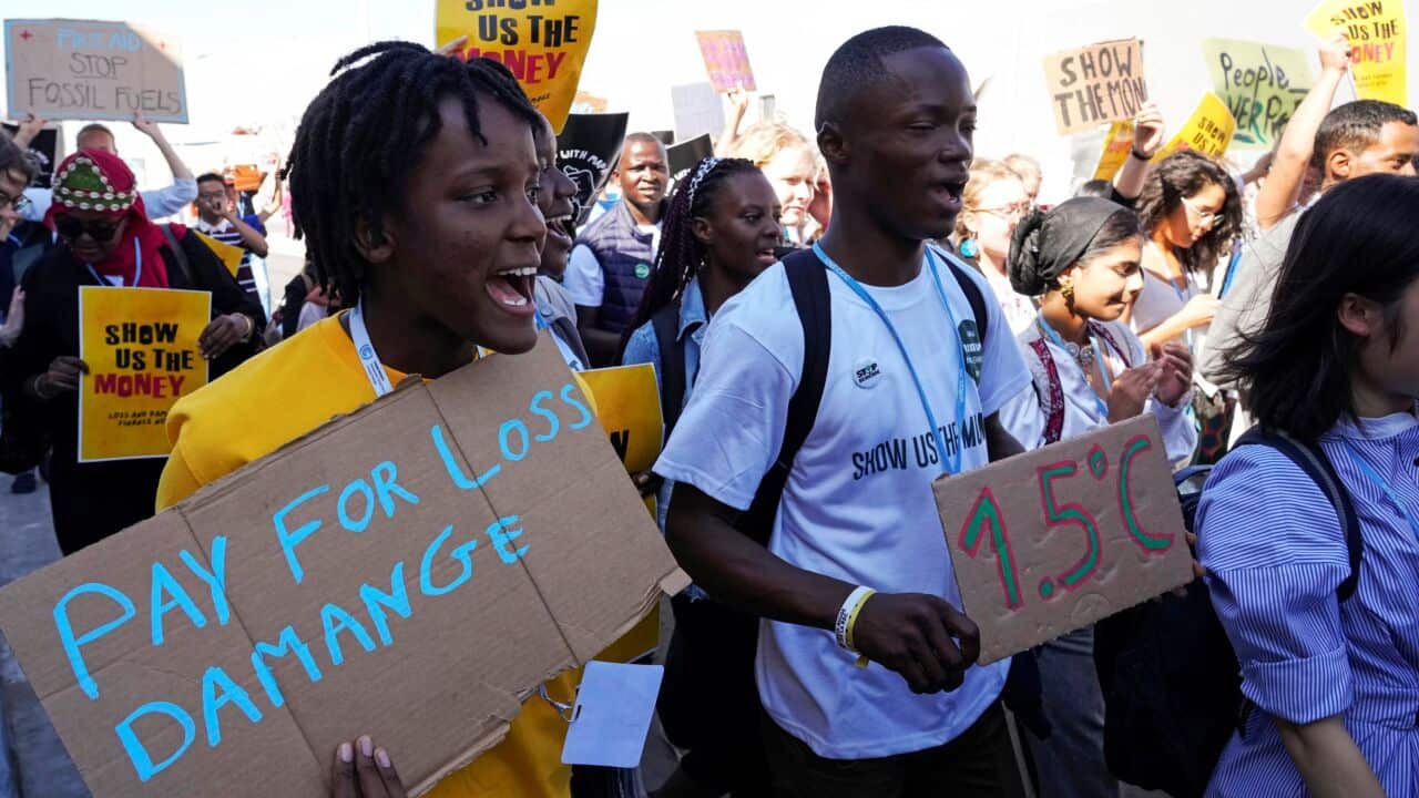 Vanessa Nakate, of Uganda, left, participates in a Fridays for Future protest at the COP27 U.N. Climate Summit