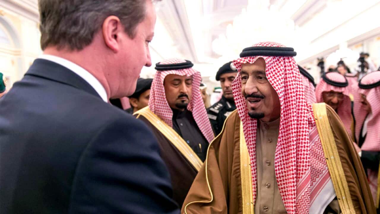 newly enthroned Saudi King Salman, right, greets David Cameron.