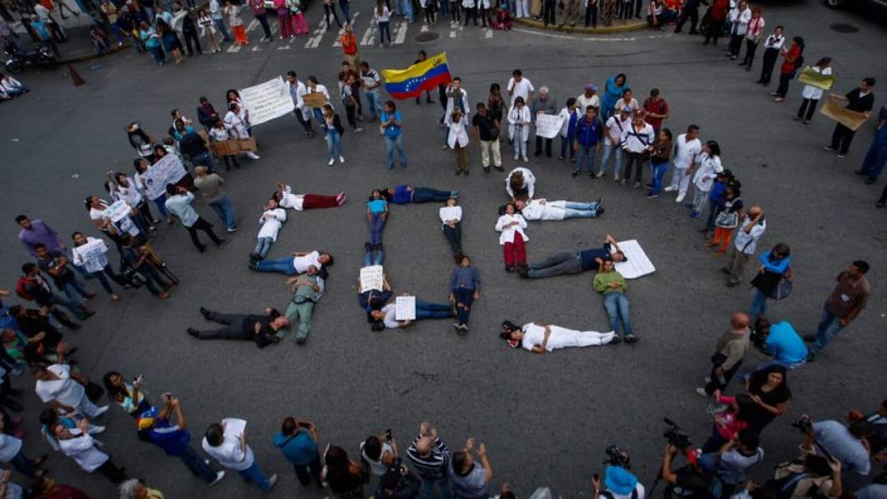 Doctors, nurses and public hospital staff protest to demand better wages, medicines and medical supplies in Caracas, Venezuela, 02 August 2018.