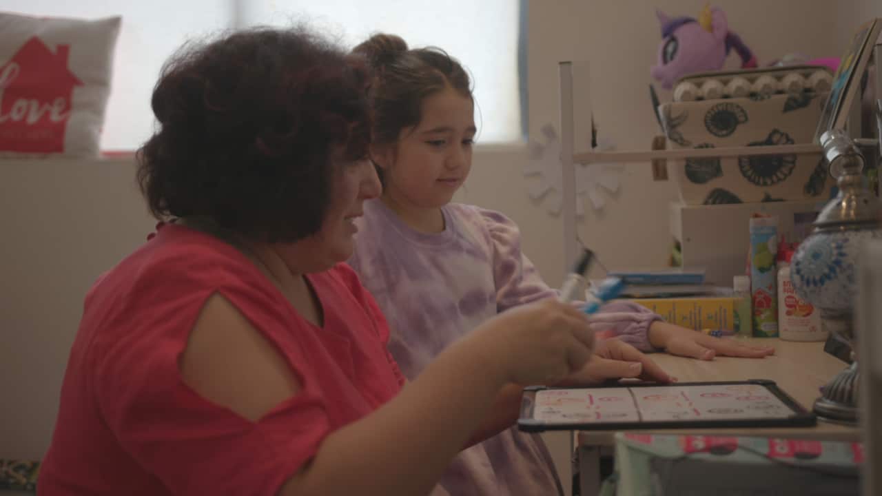 Karina says it has taken some time to get into the swing of homeschooling her daughter Liza