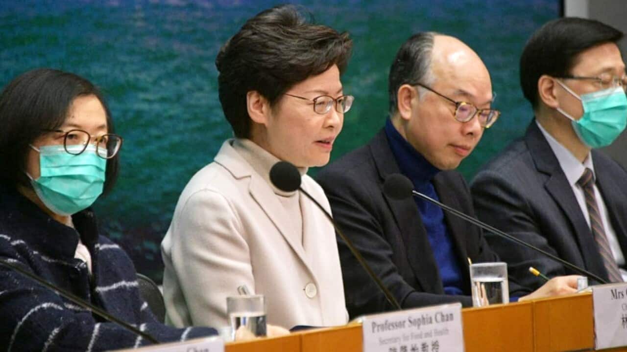 City’s chief executive bars civil servants from wearing the surgical masks, providing only three exemptions.