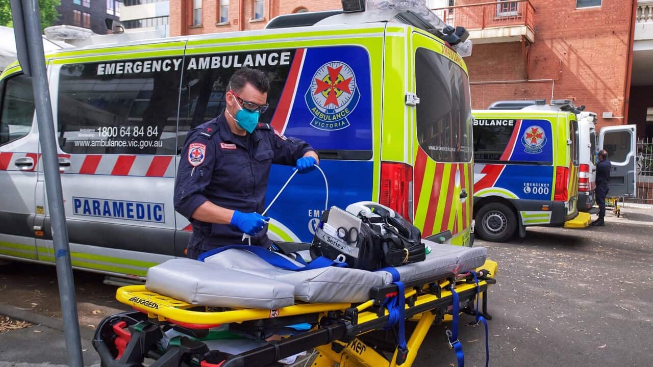 A paramedic moving equipmentoutside St. Vincent's hospital in Melbourne