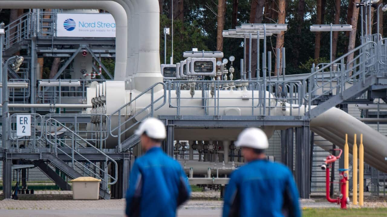 Workers at a receiving sattion of the Nord Stream 1 gas pipeline.