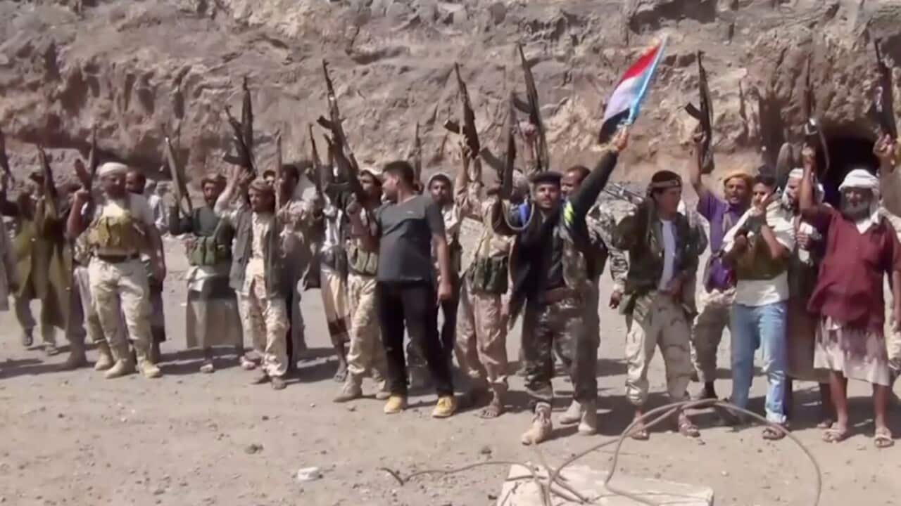 This frame grab from video shows fighters loyal to the separatist so-called Southern Transitional Council, chanting after taking Aden