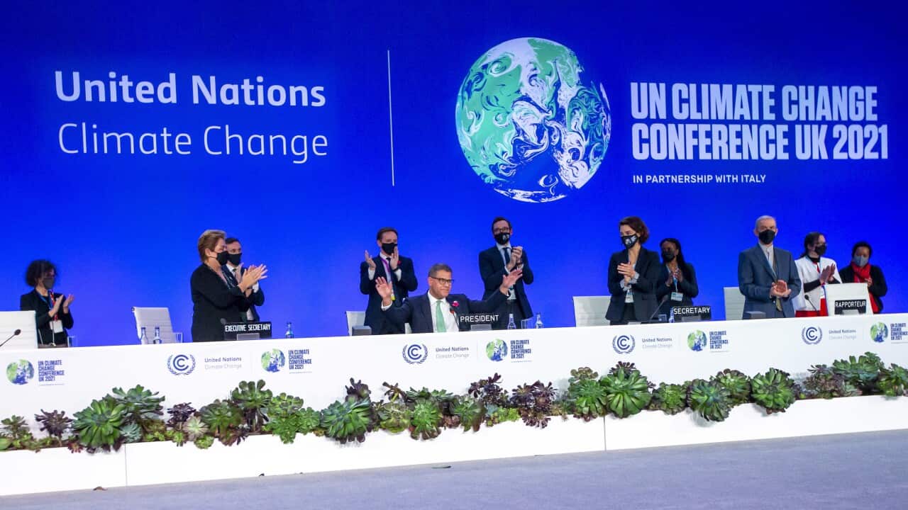 Alok Sharma (C), President COP26 receives a standing ovation during the Plenary session of the COP26 UN Climate Change Conference in Glasgow