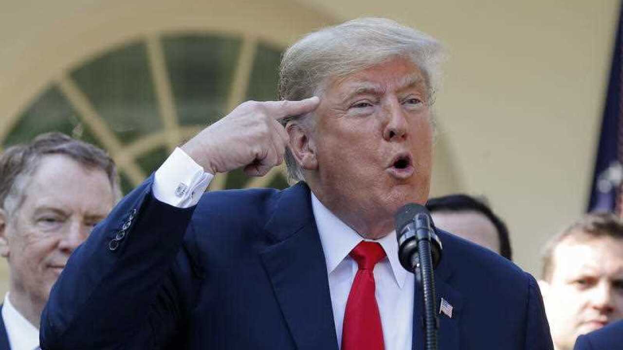 President Donald Trump gestures while answering questions from members of the media about Supreme Court nominee Judge Brett Kavanaugh in the Rose Garden of the White House in Washington, Monday, Oct. 1, 2018.