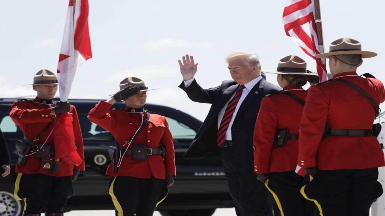 President Donald Trump arrives at the Canadian Forces Base Bagotville