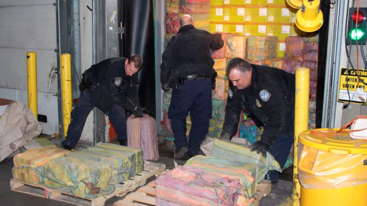 photo provided by U. S. Customs and Border Protection shows Customs agents unloading a truck containing cocaine where it was seized in New York