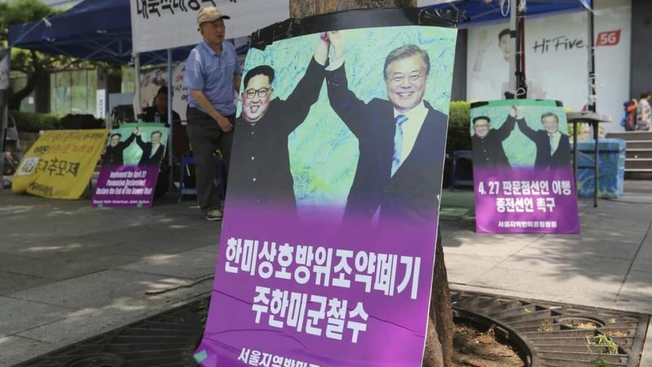 A poster showing Kim Jong-un and Moon Jae-in
