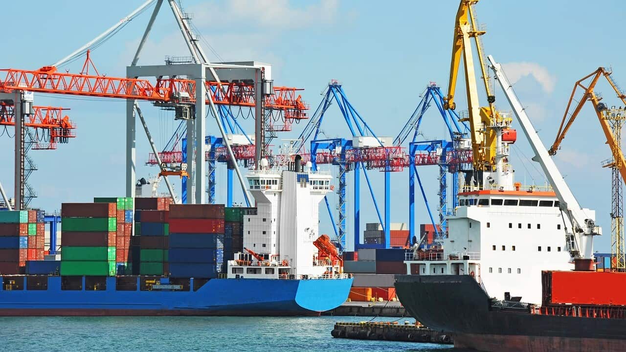 Bulk carriers dock at a port.