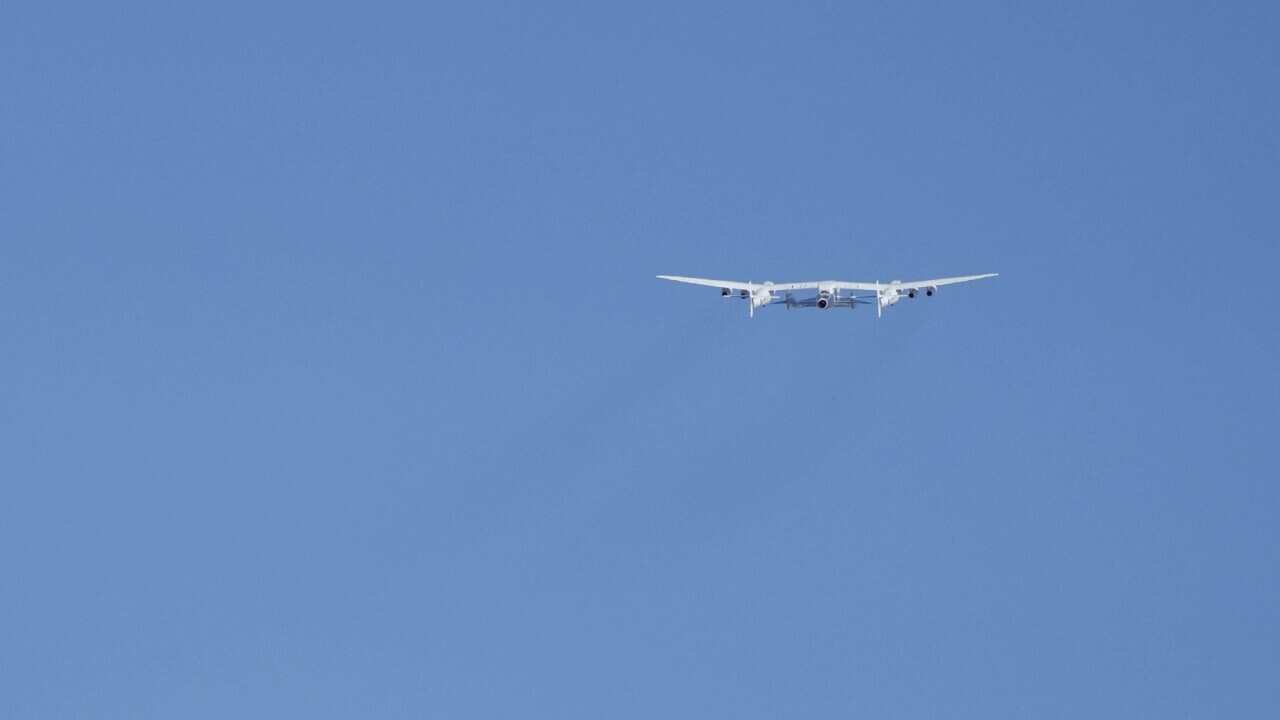 Virgin Galactic's VMS Eve carries the VSS Unity on takeoff from Spaceport Americ