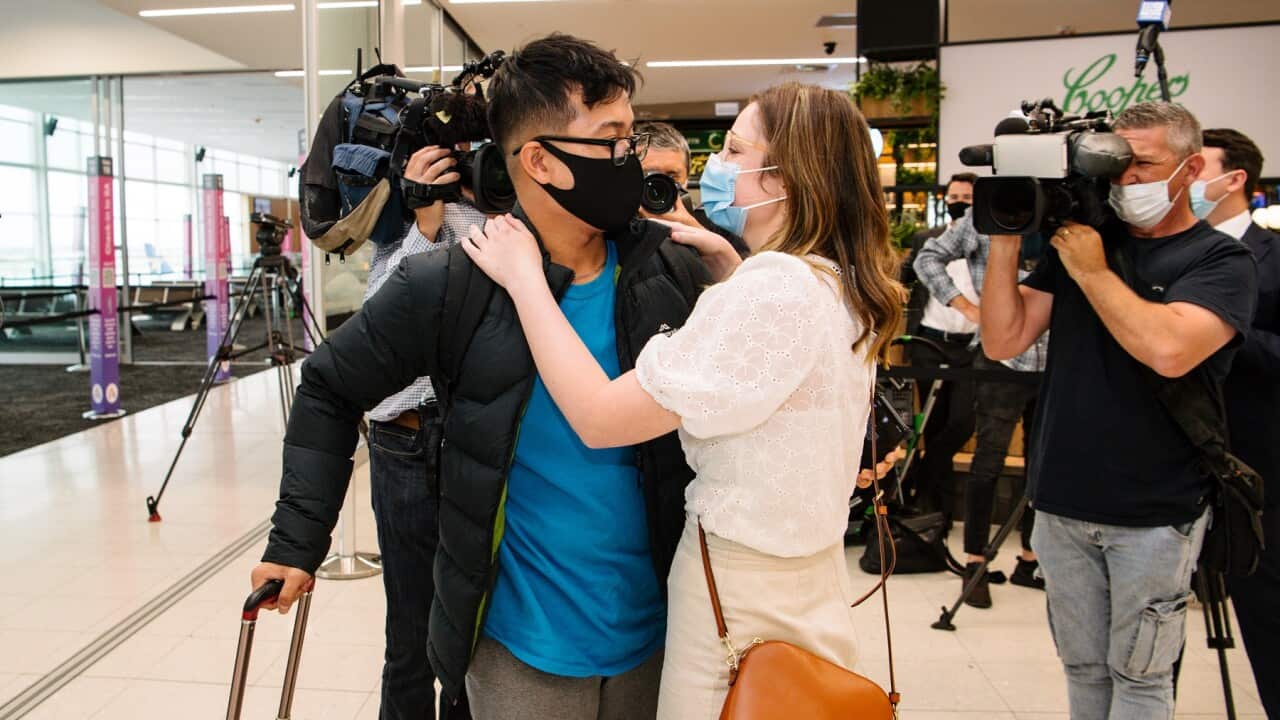 Hung Nguyen and Isabella Hill are reunited at Adelaide airport after a year apart