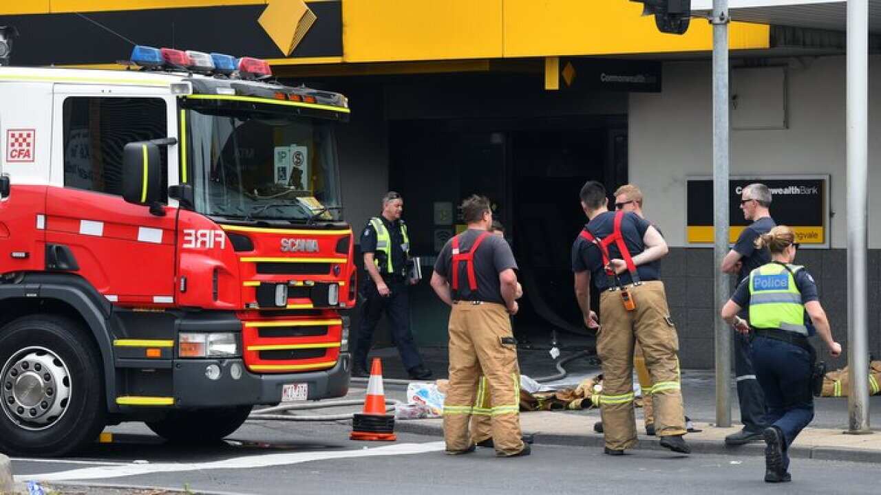 Emergency service workers are seen at the Commonwealth Bank in Melbourne