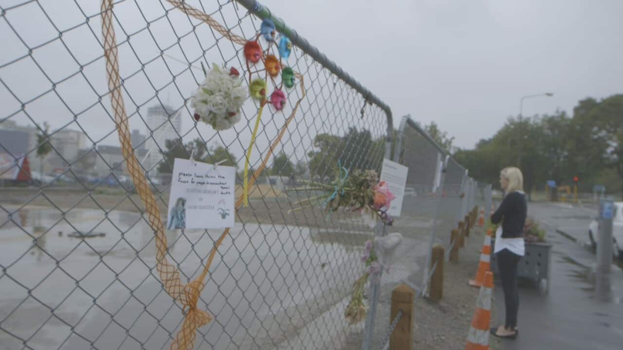 Emily Cooper looks at the empty site where the CTV building stood sbs.jpg