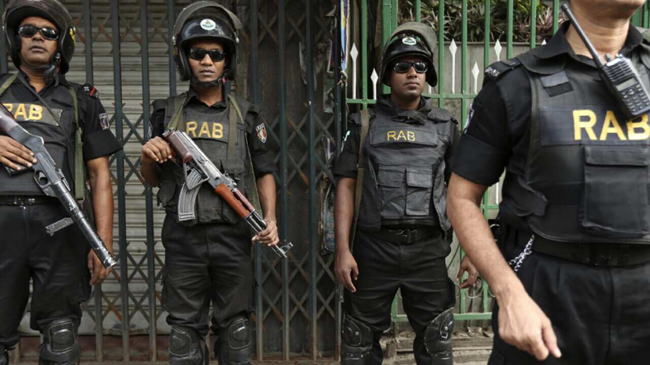 Members of the elite Rapid Action Battalion stand guard