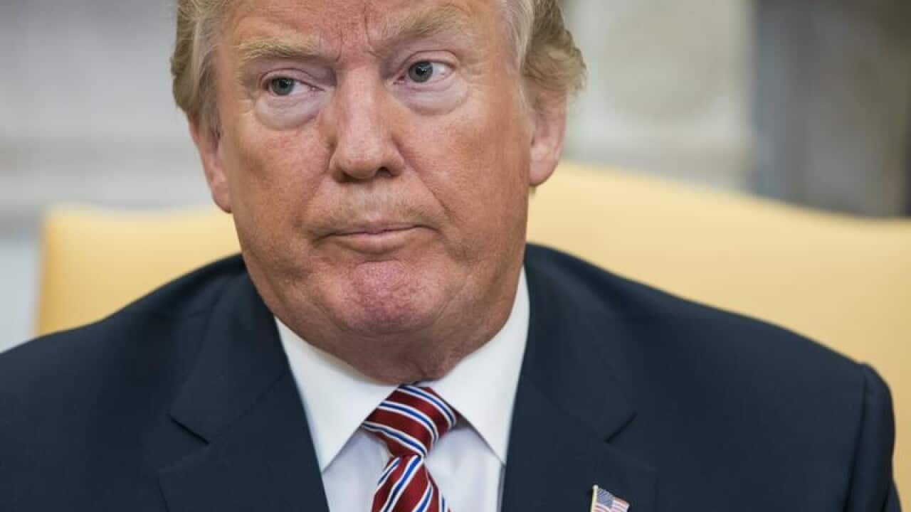 US President Donald Trump speaks to the Oval Office in Washington.
