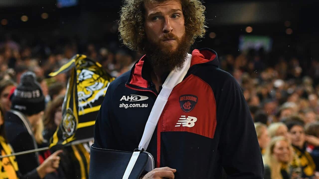 Jake Spencer of the Demons is with an injury