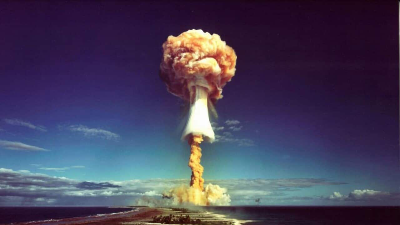 A mushroom cloud after the explosion of a French atomic bomb above the atoll of Mururoa