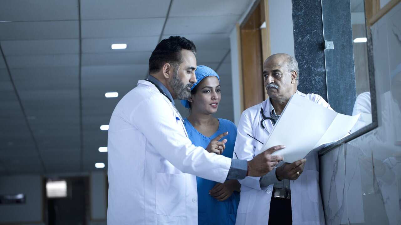 Medical practitioners having a discussion in a hospital