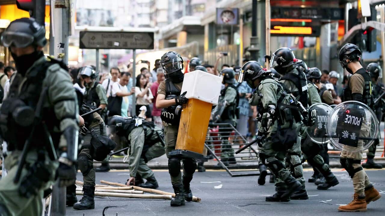 Police officers remove the barricade in Hong Kong on Oct. 13, 2019.( The Yomiuri Shimbun via AP Images )