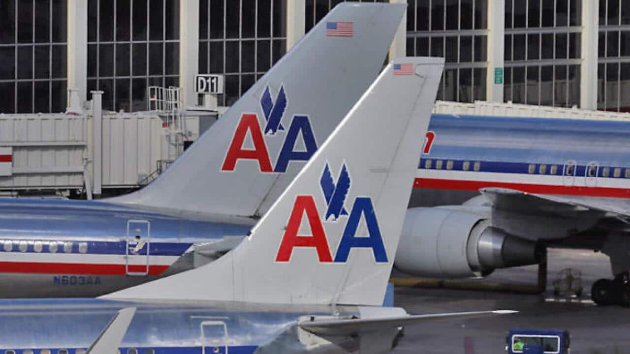 American Airlines has grounded a flight attendant who got into a confrontation with a passenger.