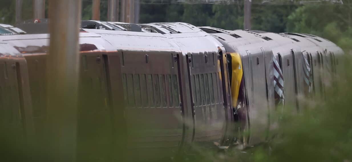 One killed and dozens hurt in train collision north of London