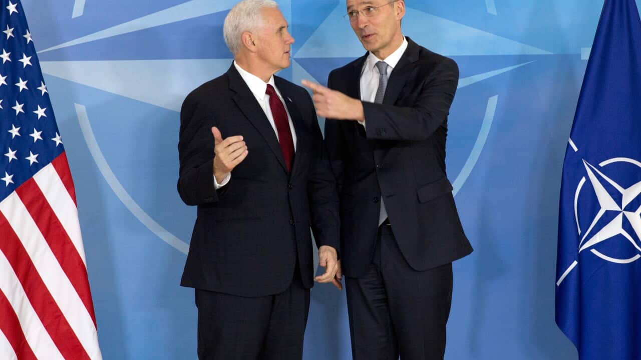 United States Vice President Mike Pence (L) is welcomed by NATO Secretary General Jens Stoltenberg (R), during a meeting at the NATO headquarters in Brussels