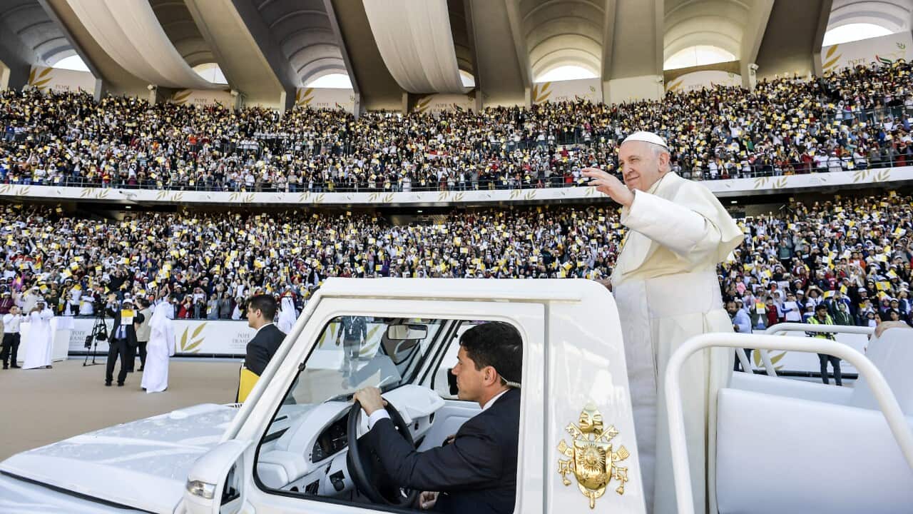 Pope Francis greets the faithfuls as he arrive to celebrate a Mass at the Sheikh Zayed Sports City in Abu Dhabi, United Arab Emirates.