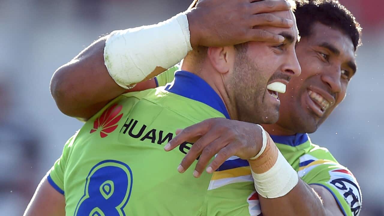 Paul Vaughan (left) of the Raiders is congratulated by Iosia Soliola