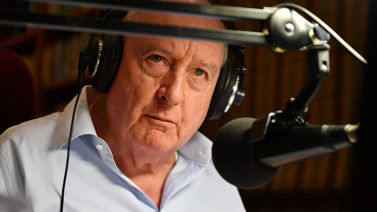 A man speaking into a microphone.