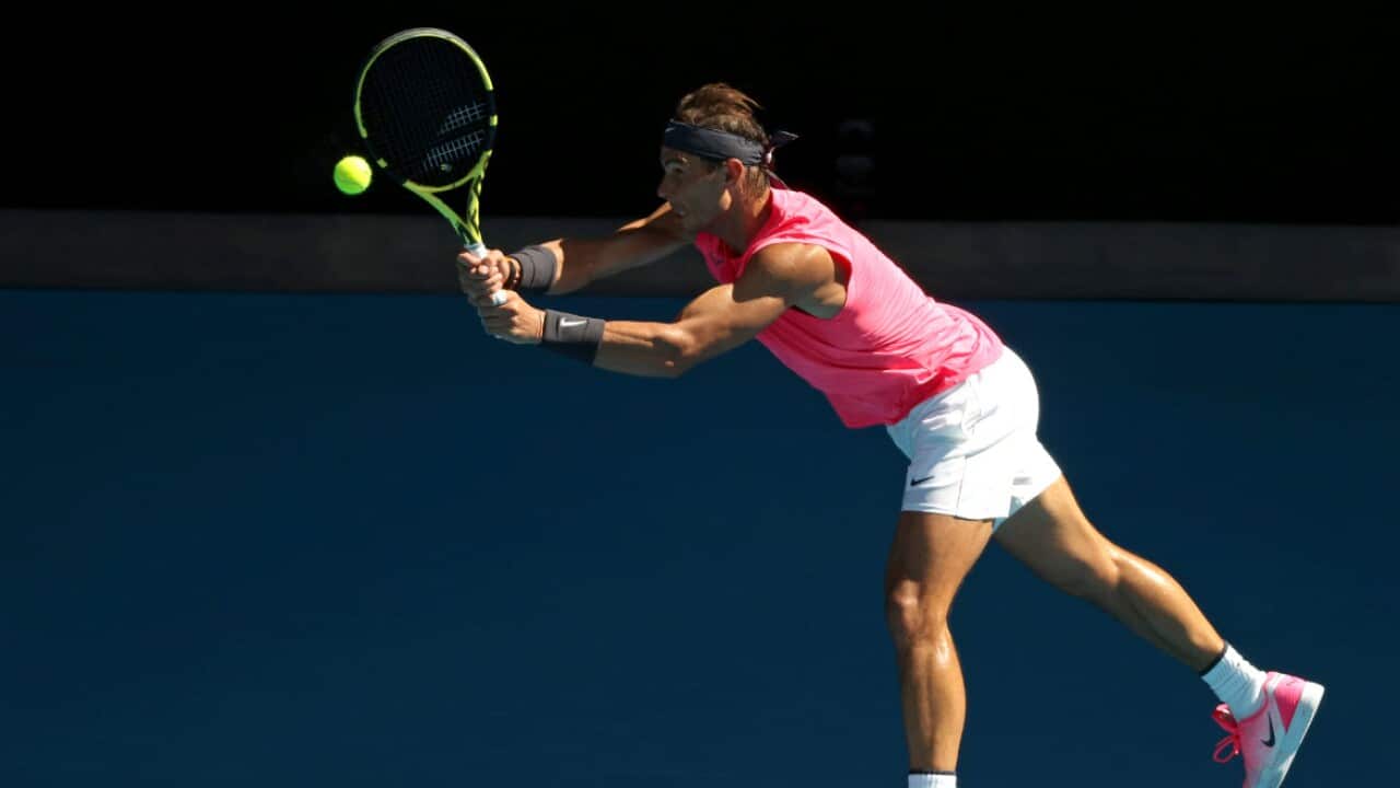 Rafael Nadal of Spain plays a backhand during an Australian Open practice session at Melbourne Park in Melbourne.