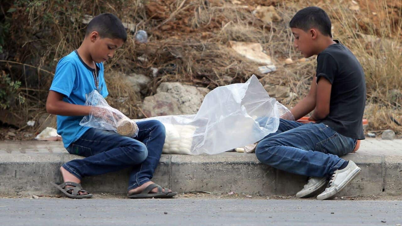 Syrian refugee boys prepare sweets to sell in the streets of Beirut -1.jpg