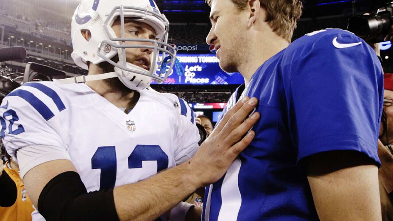 Colts quarterback Andrew Luck (12) and New York Giants' Eli Manning.