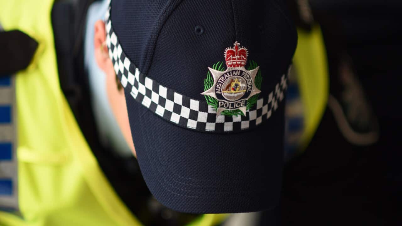 A police men wears a cap