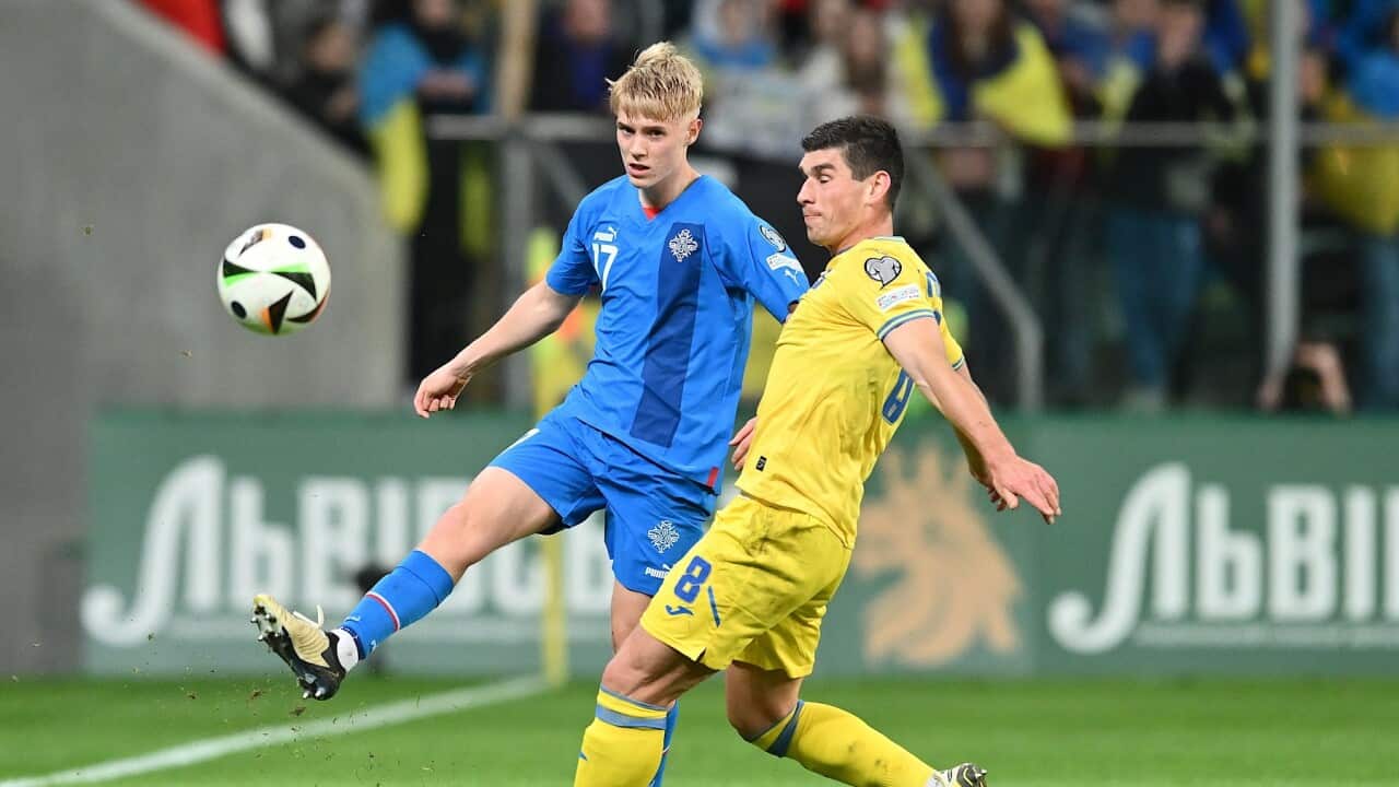 Ruslan Malinowskyi (R) of Ukraine and Hakon Haraldsson (L) of Iceland in action (AAP)