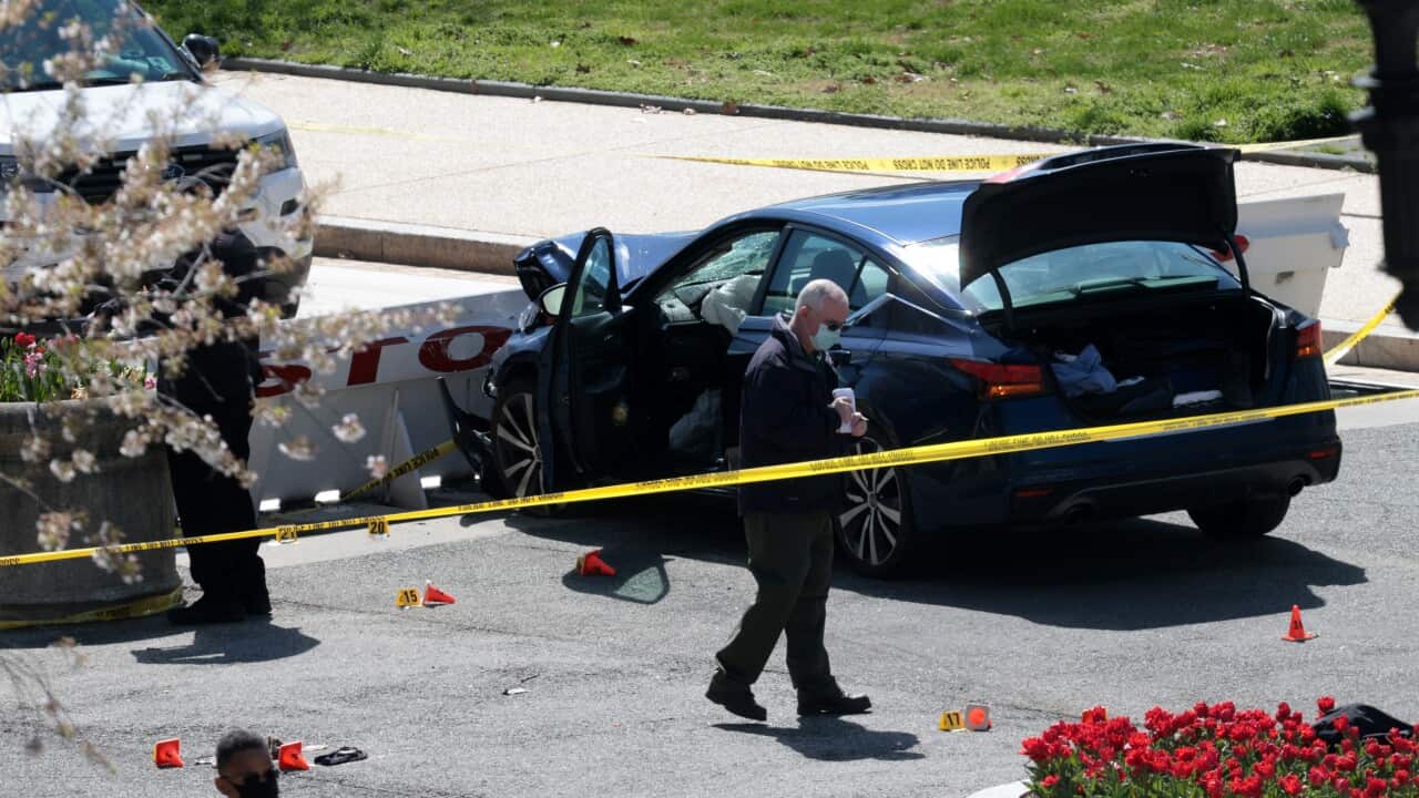 Police investigate the scene after a vehicle charged a barricade at the US Capitol on 2 April.