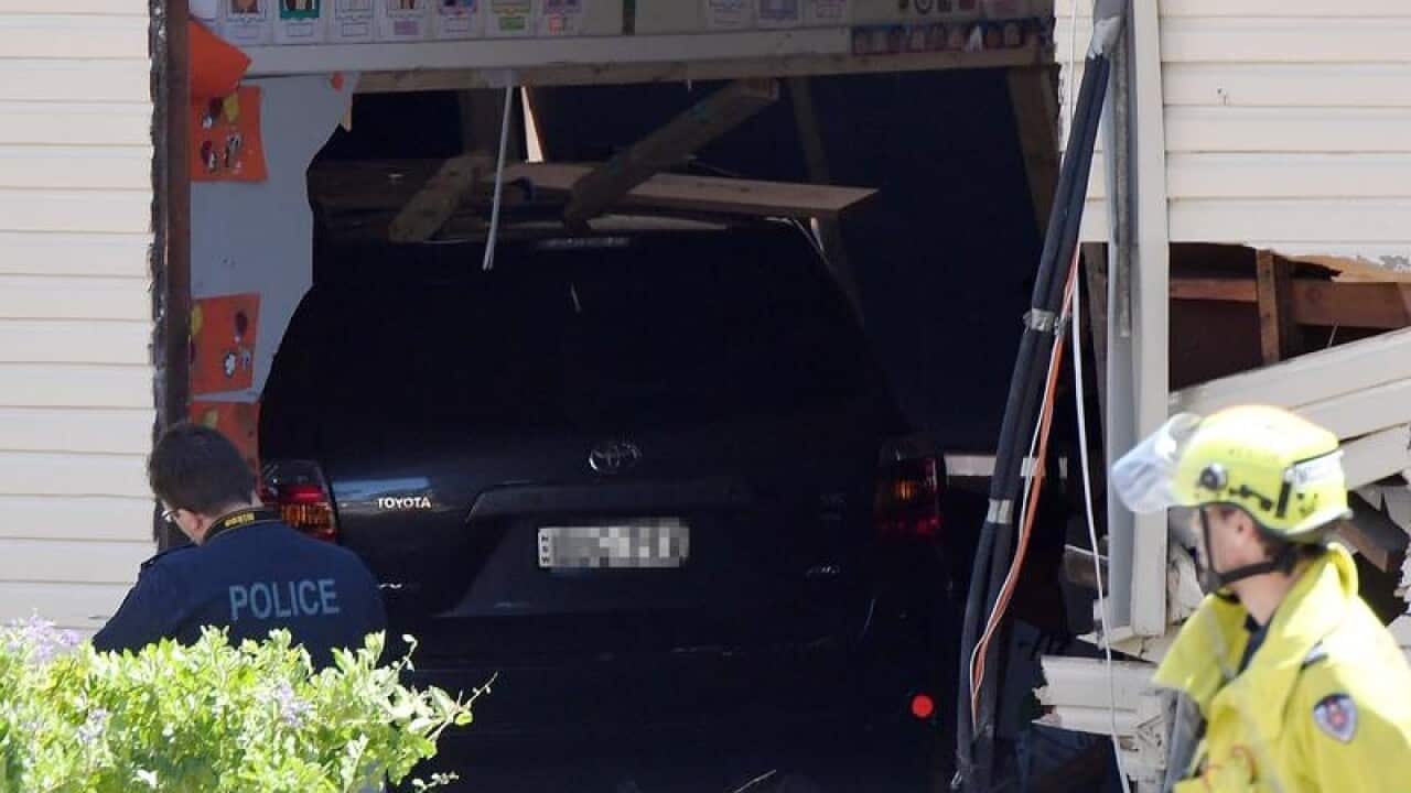Two boys, eight, were killed after a car ploughed into a classroom in Sydney's southwest