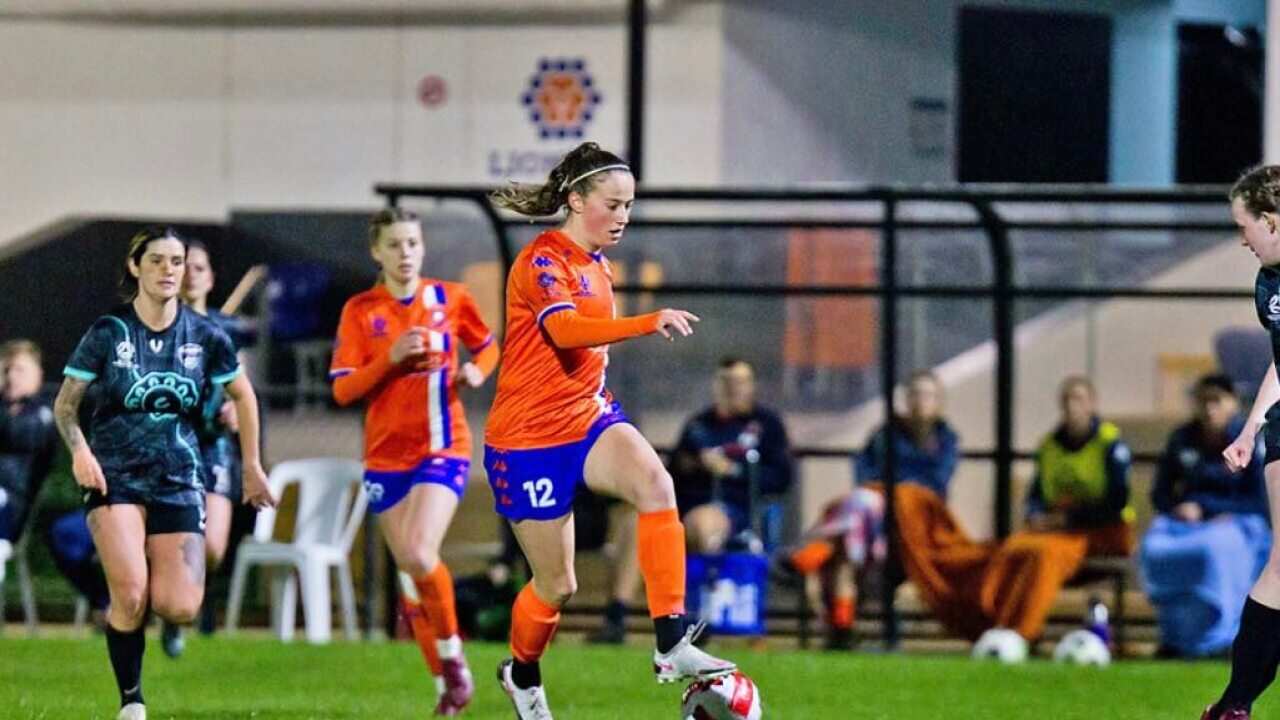 Soccer player Angela Versluis in action for Lions FC