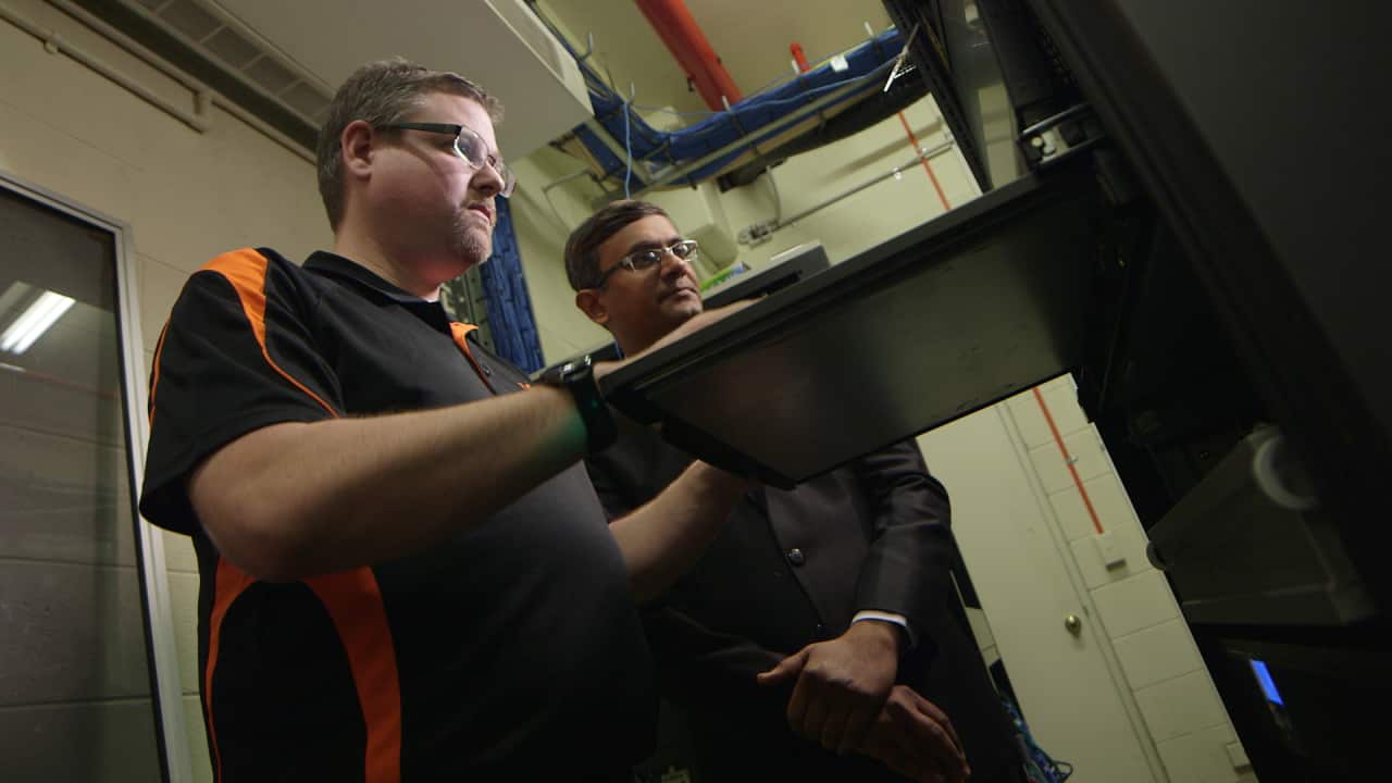 Geek's senior network engineer Andrew Huxtable with client Bhavin Patel.