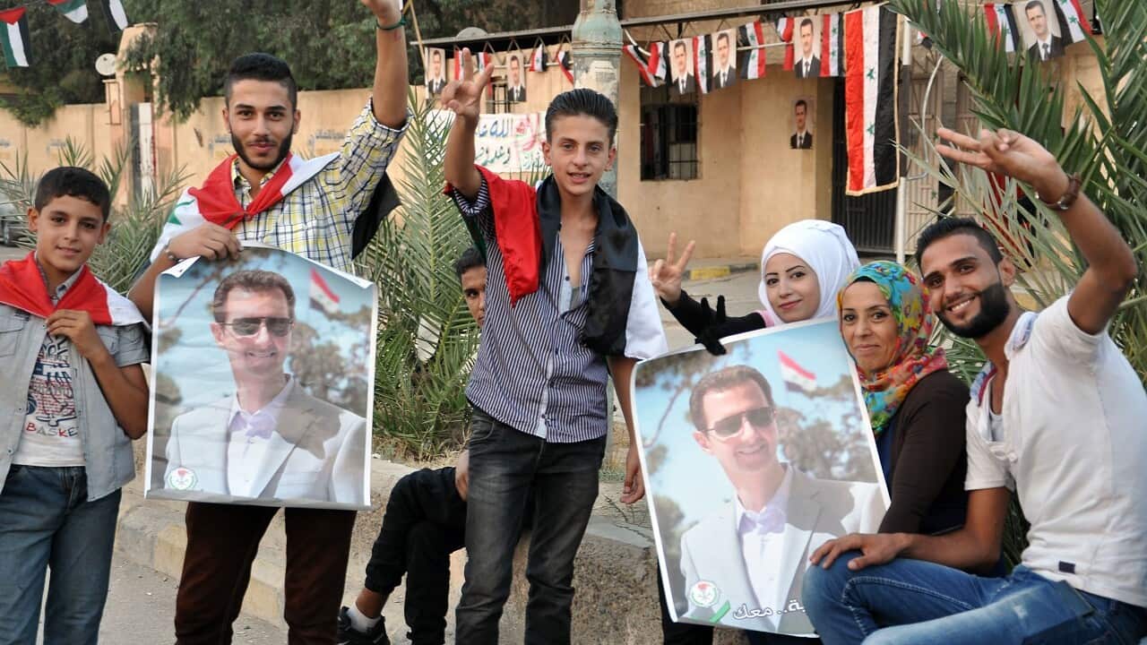 Syrians celebrate in the streets of Deir Ezzor after Syria's army broke a years-long Islamic State group siege on the government enclave on September 5, 2017.