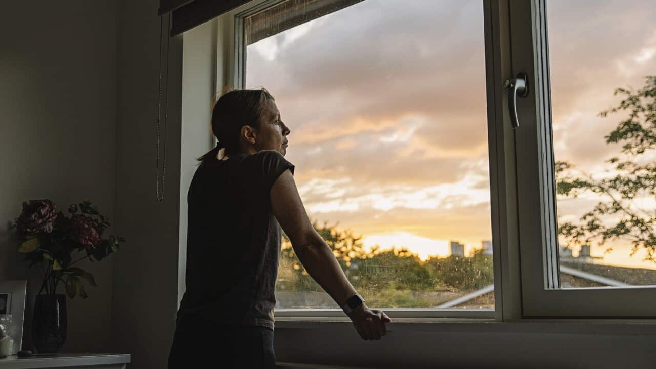 Woman looking out of window